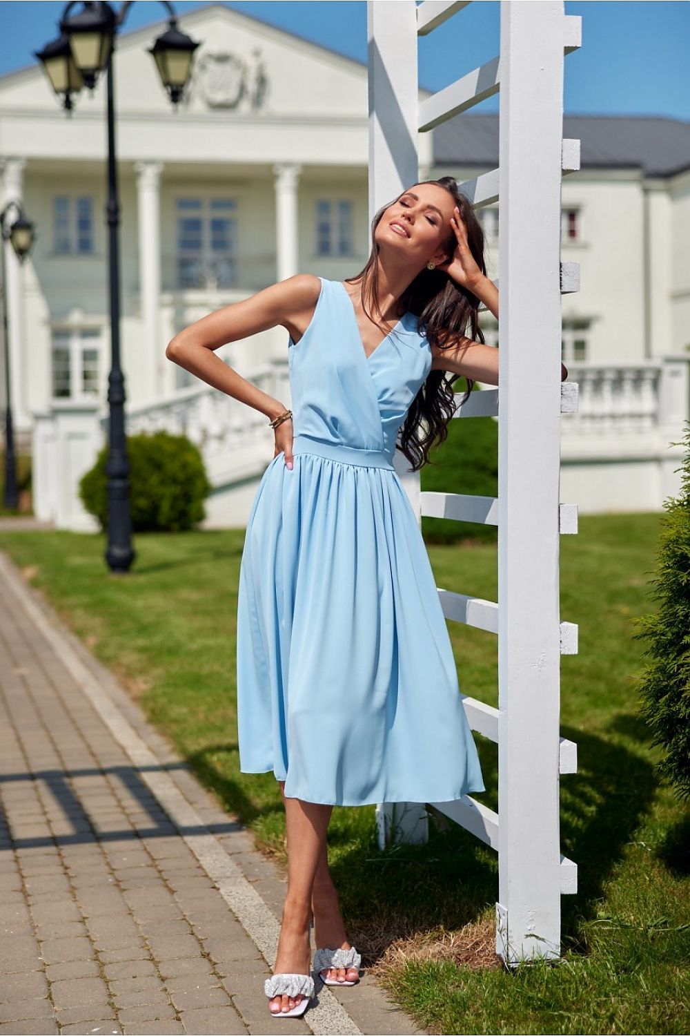 Roco Fashion's stunning midi dress displayed on a mannequin, demonstrating its chic and feminine silhouette, perfect for elegant occasions.
