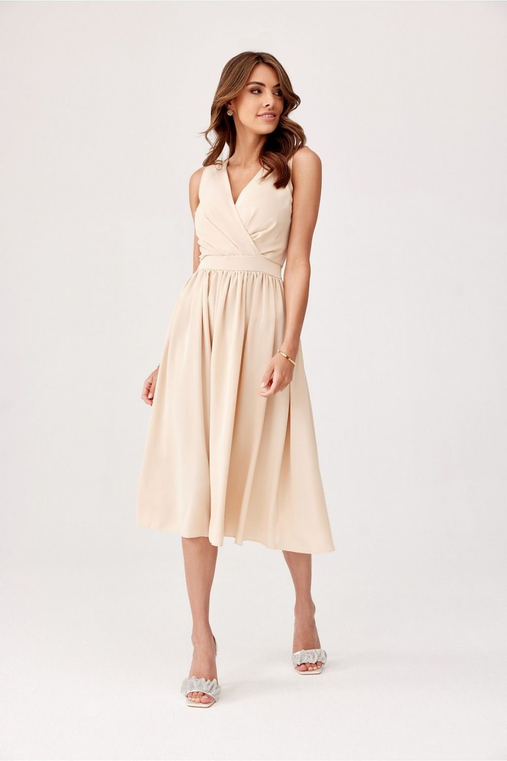 Roco Fashion's structured midi dress displayed in a sophisticated setting, ideal for weddings and formal events.