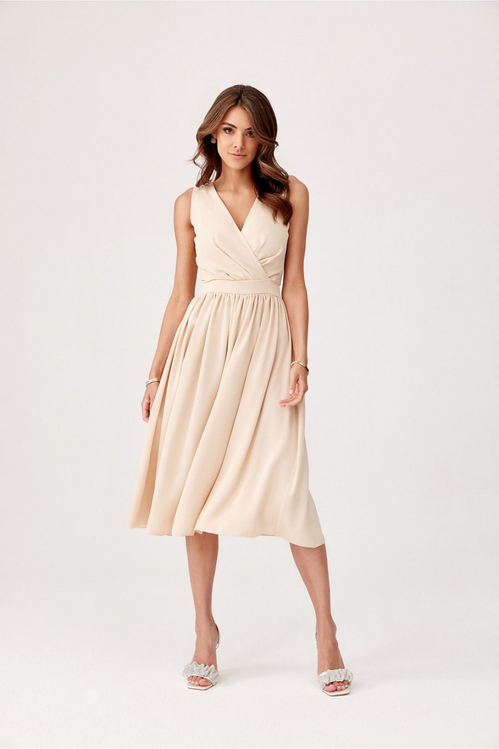 Elegant midi cocktail dress by Roco Fashion featuring an envelope neckline and tapered waist, perfect for formal occasions.