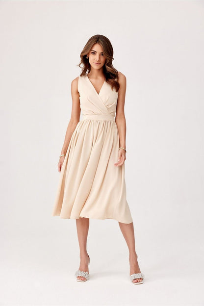 Elegant midi cocktail dress by Roco Fashion featuring an envelope neckline and tapered waist, perfect for formal occasions.
