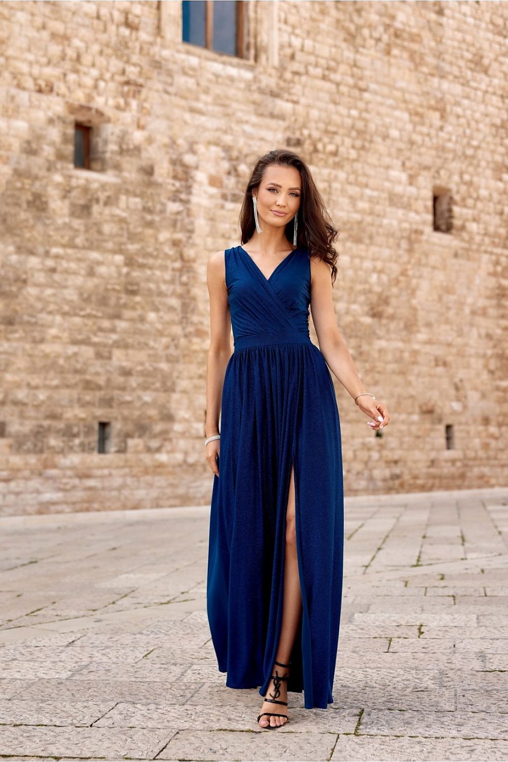 Elegant evening gown by Roco Fashion, featuring a captivating back tie and dazzling glitter details for a luxurious look.