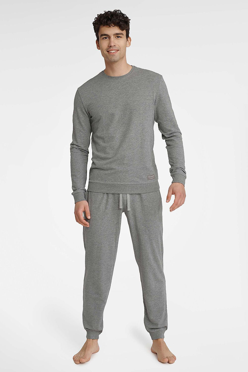 Luxury Henderson men's pajamas set featuring a stylish cotton rich T-shirt and elegant long pants with pockets, perfect for a sophisticated lounge look.
