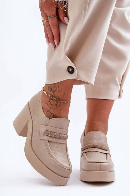 Elegant women's heeled half shoes from Step in Style, crafted with natural leather and designed with a tightening elastic band for a perfect fit, combining fashion and functionality.