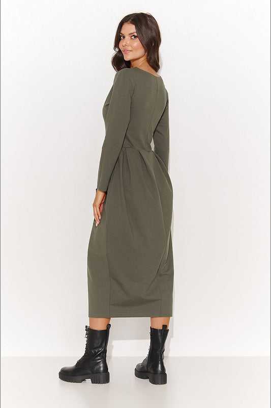 Elegant Numinou daydress in airy sand colour with pockets, embodying a luxurious casual style suitable for both informal and semi-formal gatherings.