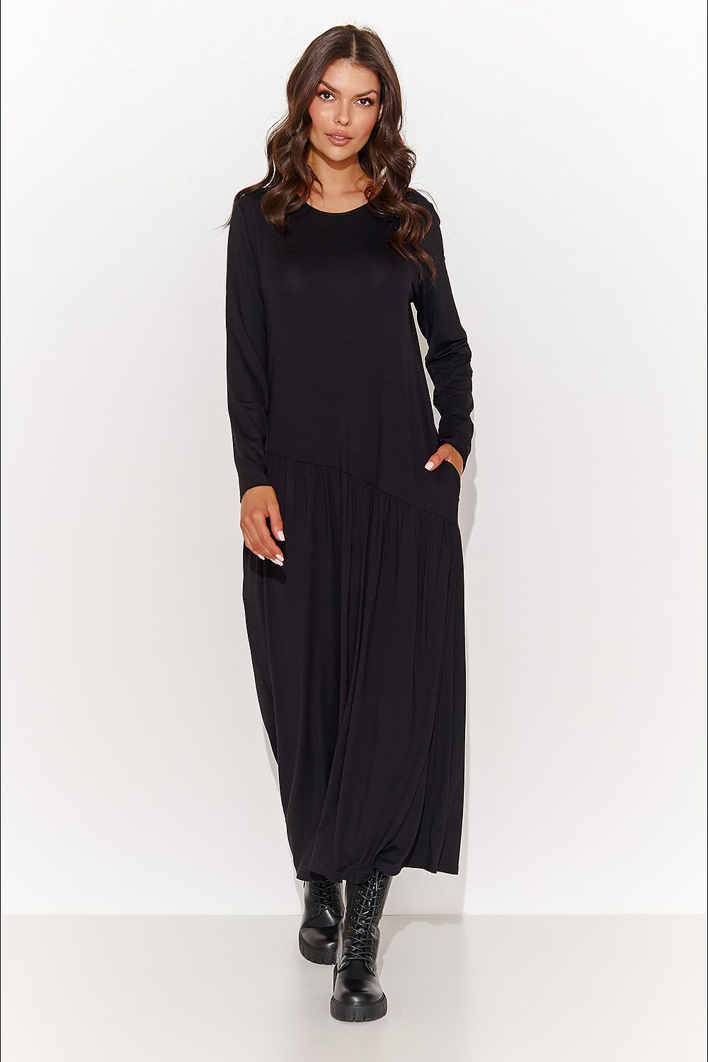 Luxurious Numinou Maxi Dress in Graphite Melange, featuring airy viscose knit fabric, round neckline, long sleeves, asymmetrical stitching, and slip pockets, perfect for sophisticated occasions.