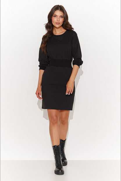 Fashion-forward Numinou casual daydress featuring a decorative plate, perfect for pairing with sports shoes for a chic look.