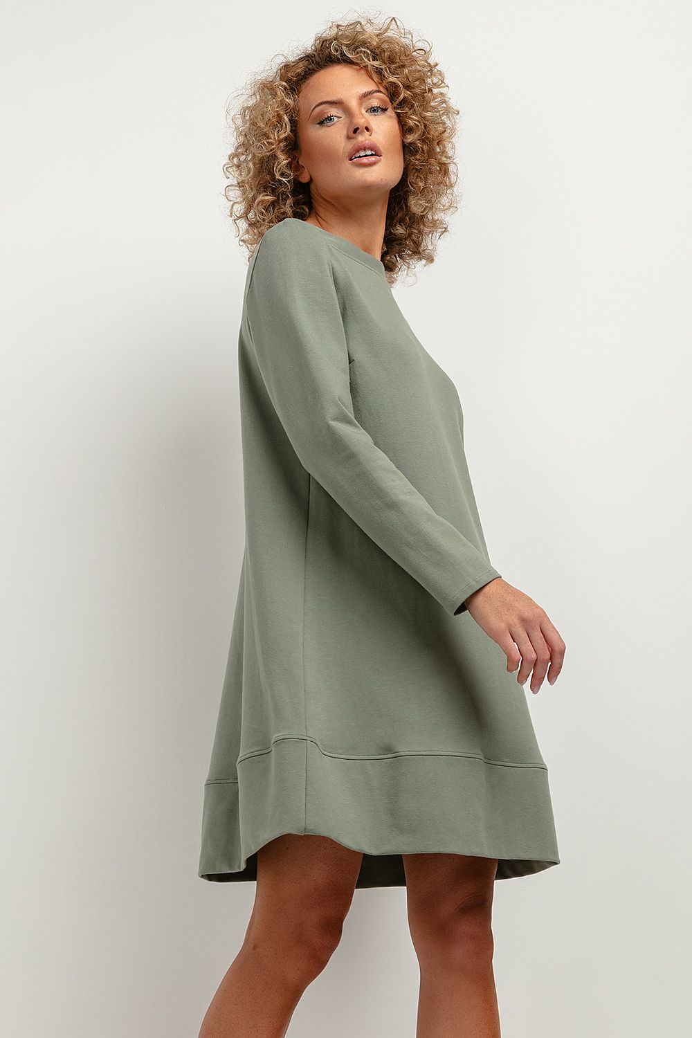 Elegant Tessita Knitted Midi Dress featuring a unique trapezoidal cut and stand-up neckline, crafted from OEKO-TEX certified fabric for luxurious autumn comfort.