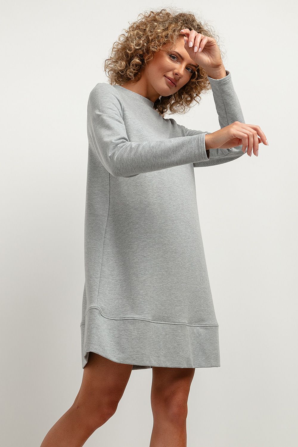 Tessita Knitted Midi Dress featuring elegant trapezoidal cut and stand-up neckline, ideal for autumn fashion.