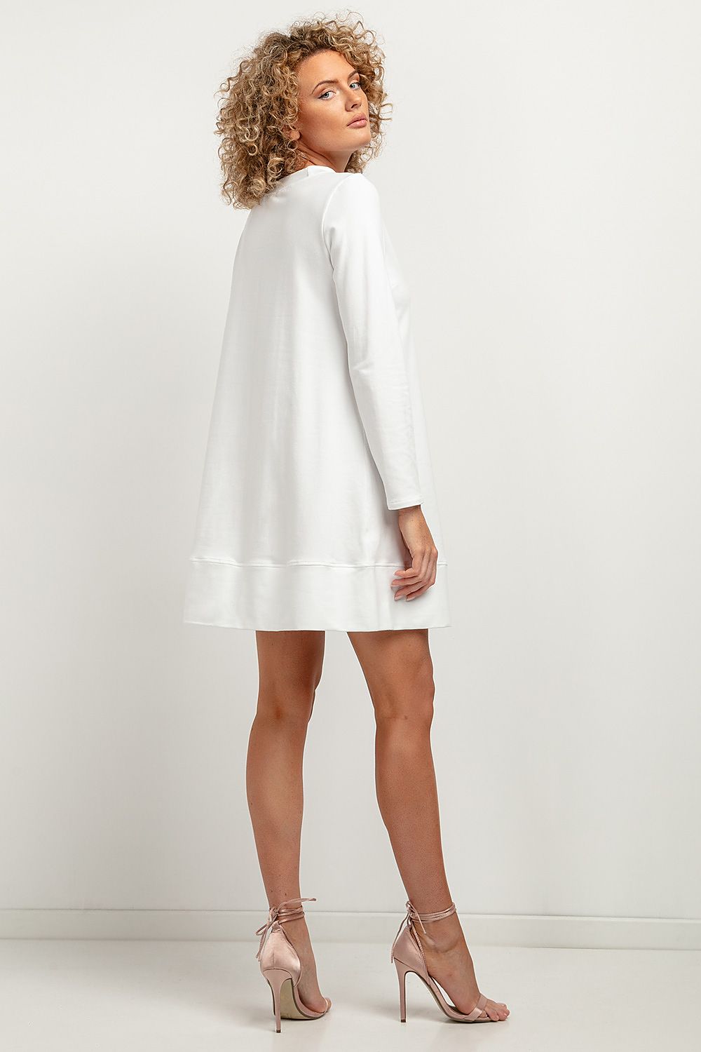 Elegant Tessita knitted midi dress featuring trapezoidal cut and stand-up neckline, perfect for autumn fashion.