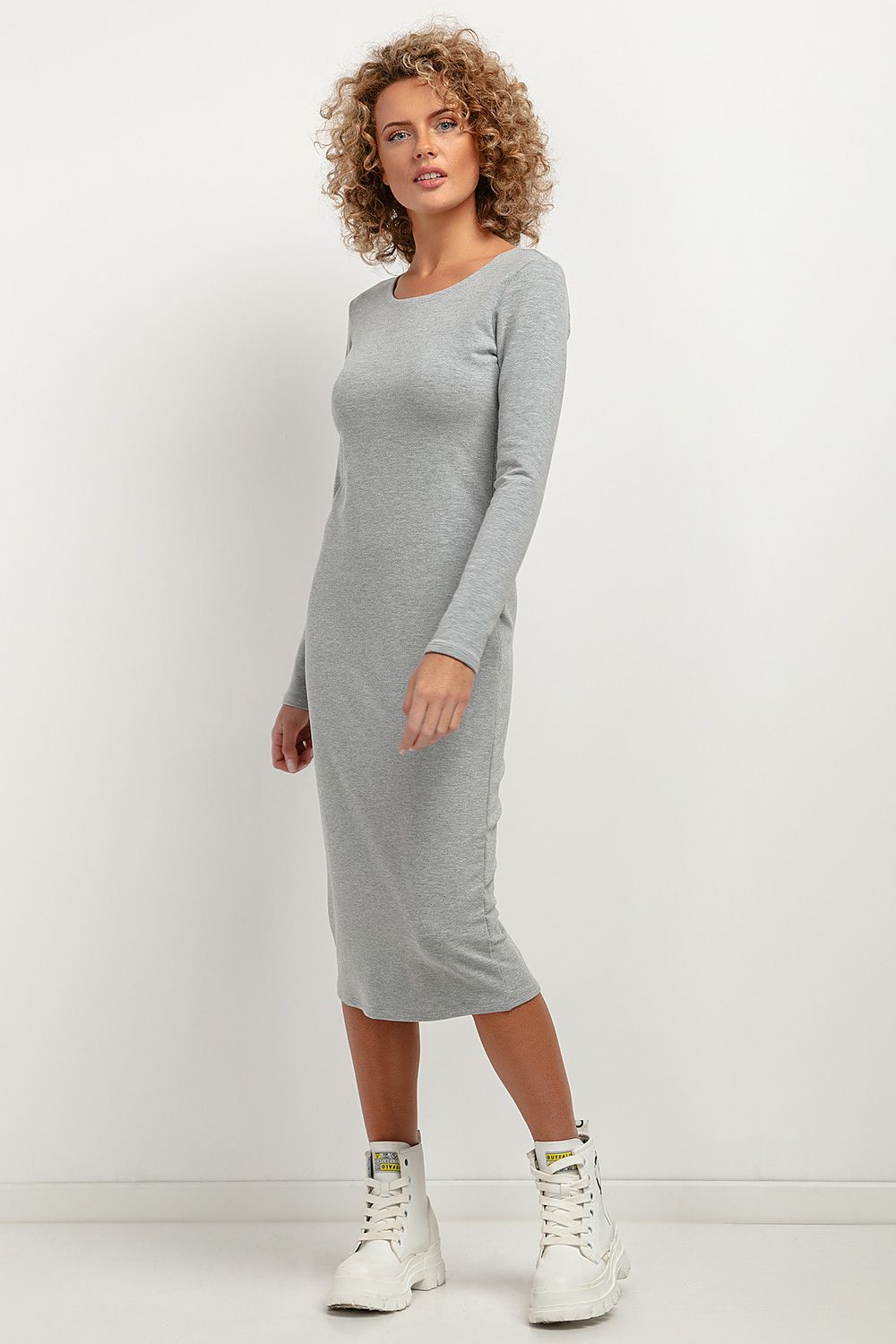 Elegant Tessita fitted midi dress with boat neckline in soft knit, showcasing a versatile and stylish silhouette.