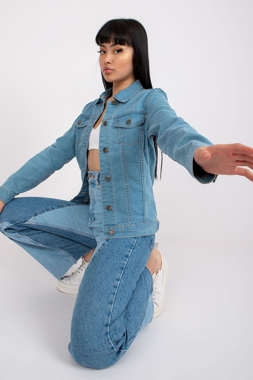 Stylish Rue Paris light blue denim jacket showcasing a classic design, perfect for casual chic styles.