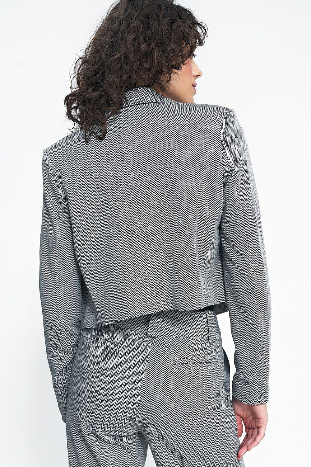 Stylish Nife Women's Short Jacket, showcasing luxurious fabric blend, ideal for sophisticated casual outfits.