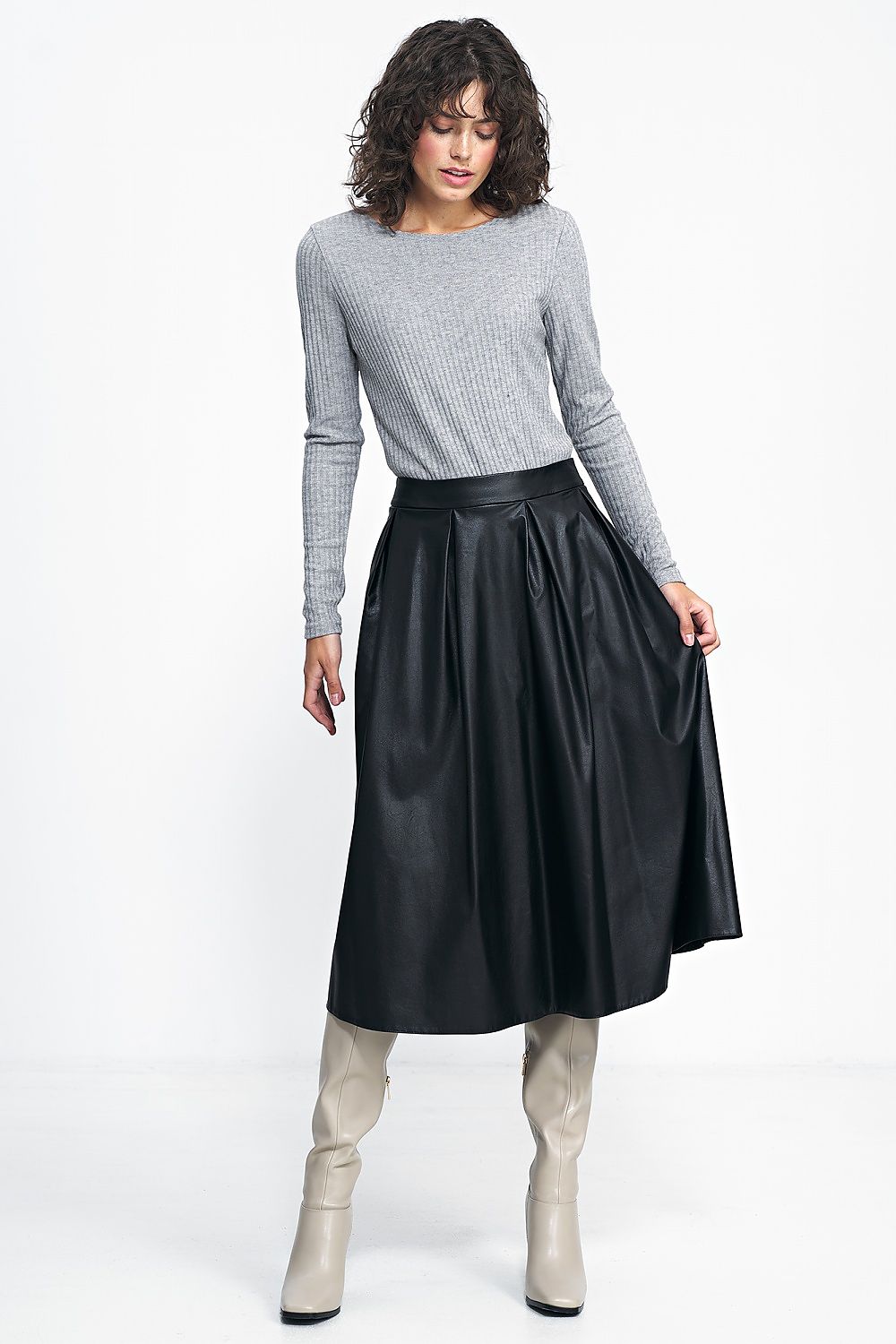 Close-up view of Nife's Luxury Midi Pleated Skirt with a waist belt, crafted from high-quality imitation leather, ideal for enhancing feminine silhouette.