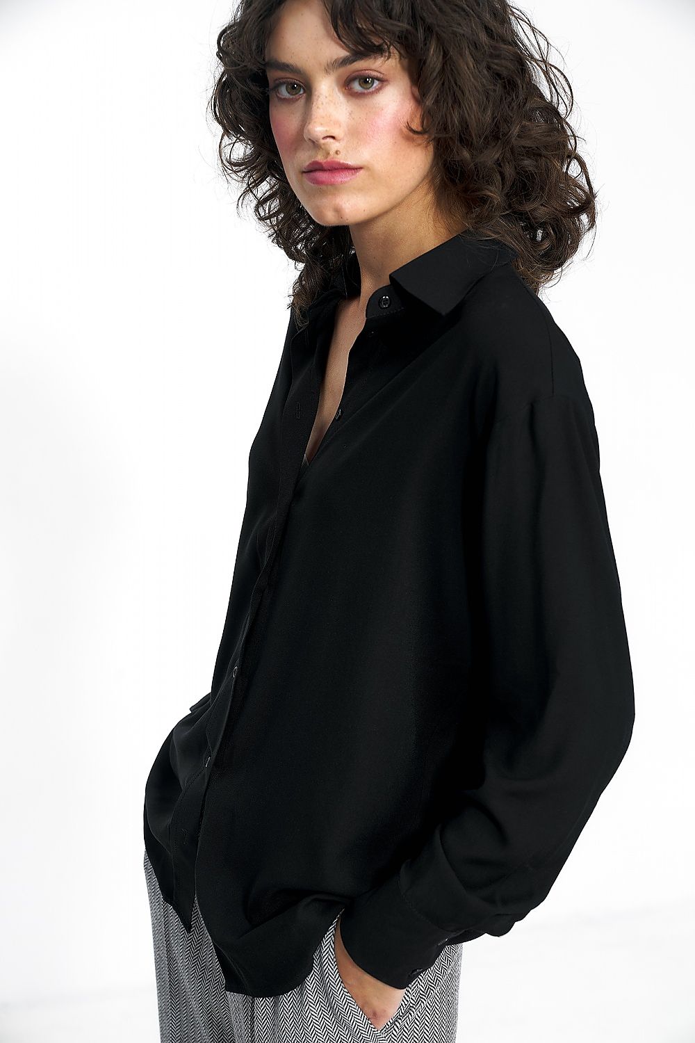 Flat lay of the Luxury Nife 100% viscose blouse in muted shades, ideal for fashionable workwear and casual outings.