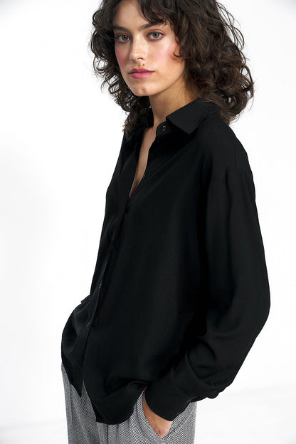 Flat lay of the Luxury Nife 100% viscose blouse in muted shades, ideal for fashionable workwear and casual outings.