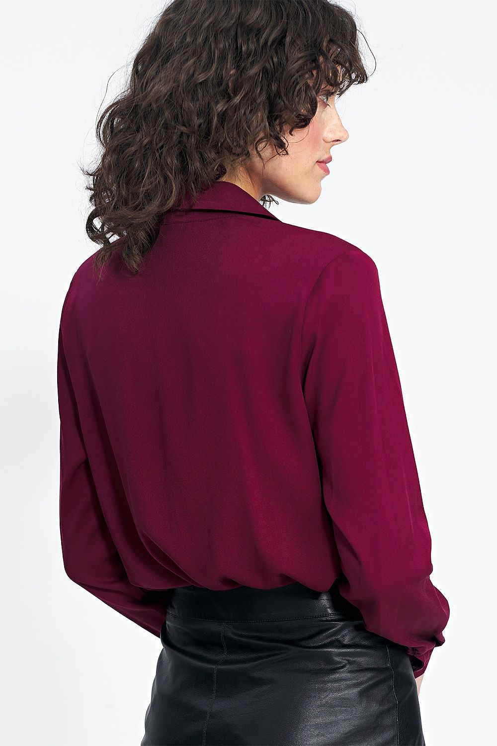 Chic Nife burgundy shirt displayed with stylish pants, showcasing its versatility and premium material.