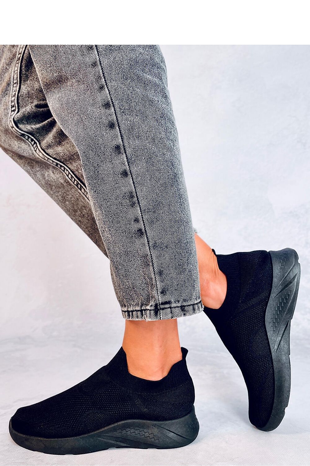 Chic women's slip-on sports shoes by Inello, designed with airy fabric and a cushioned footbed for stylish athletic wear.