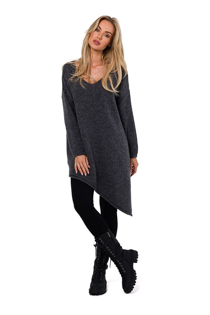 Side view of the Moe luxury women's asymmetrical sweater, focusing on the elegant side slit detail and fine craftsmanship.