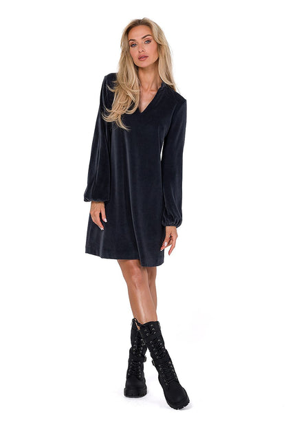 Luxurious velour dress with long sleeves and V neckline by Moe, showcasing a trapeze cut for elegant style.