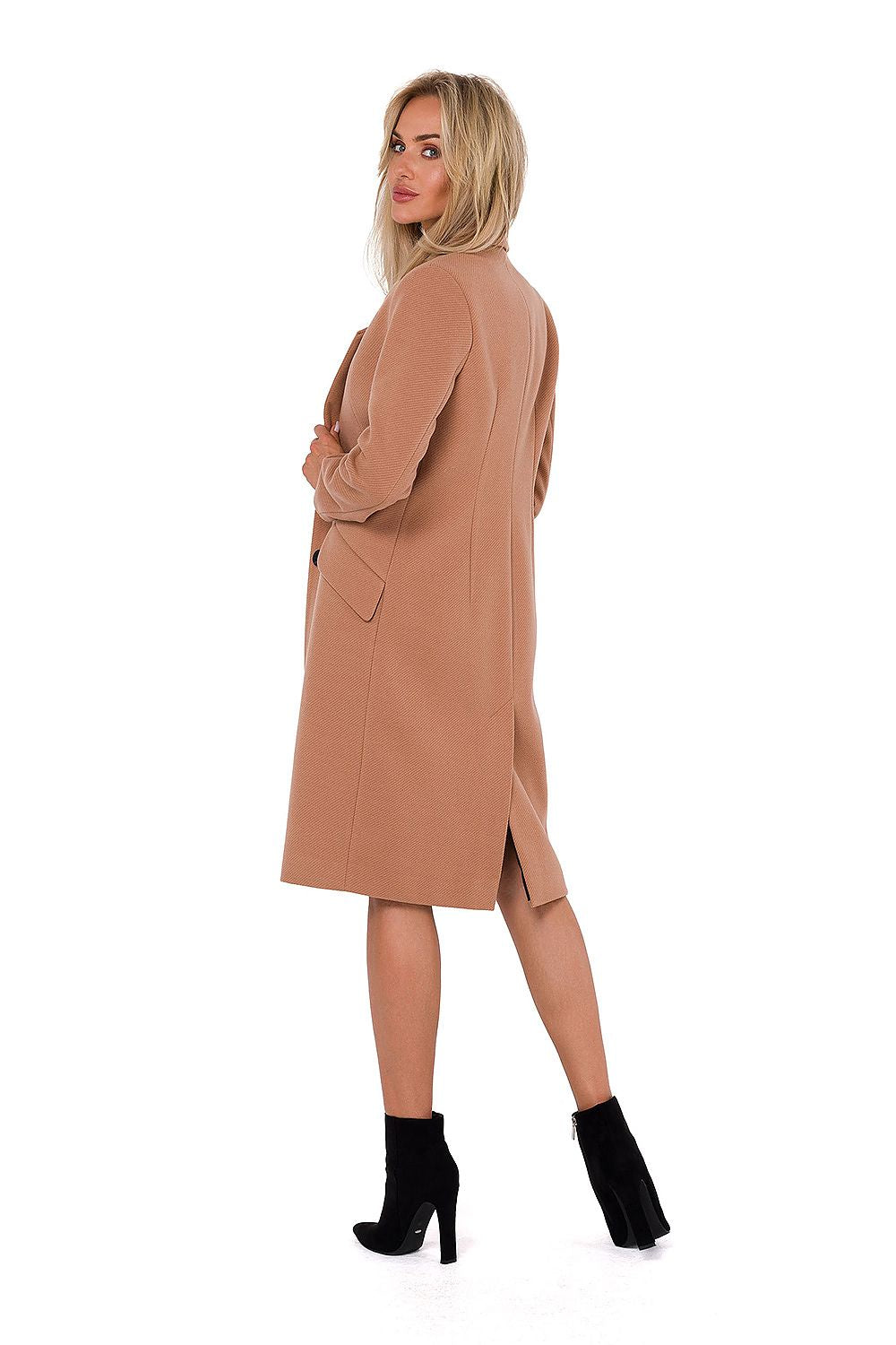 Sophisticated women's classic fleece coat by Moe in a serene outdoor setting, illustrating its luxurious appeal and perfect outerwear for the discerning woman.
