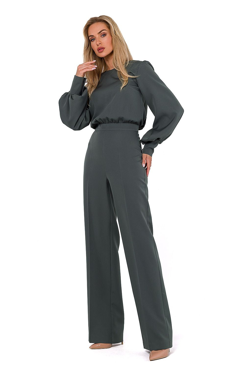 Luxurious women's jumpsuit with a flattering fit, designed by Moe, showcasing long buff sleeves and a halter top style.