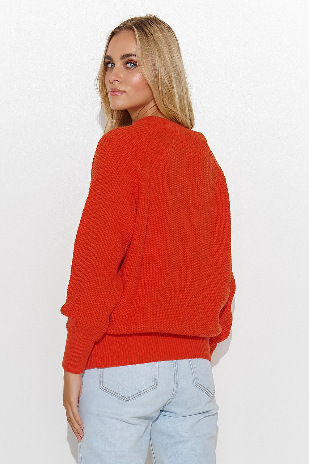 Versatile Makadamia classic sweater, perfect for casual or formal settings, highlighting an elegant heart neckline and gold tinsel accents.