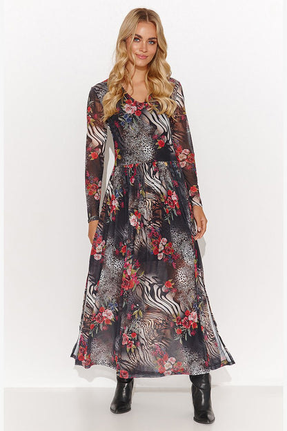 Gracefully draped Makadamia dress showcasing a semi-transparent fabric with intricate prints, ideal for refined occasions.