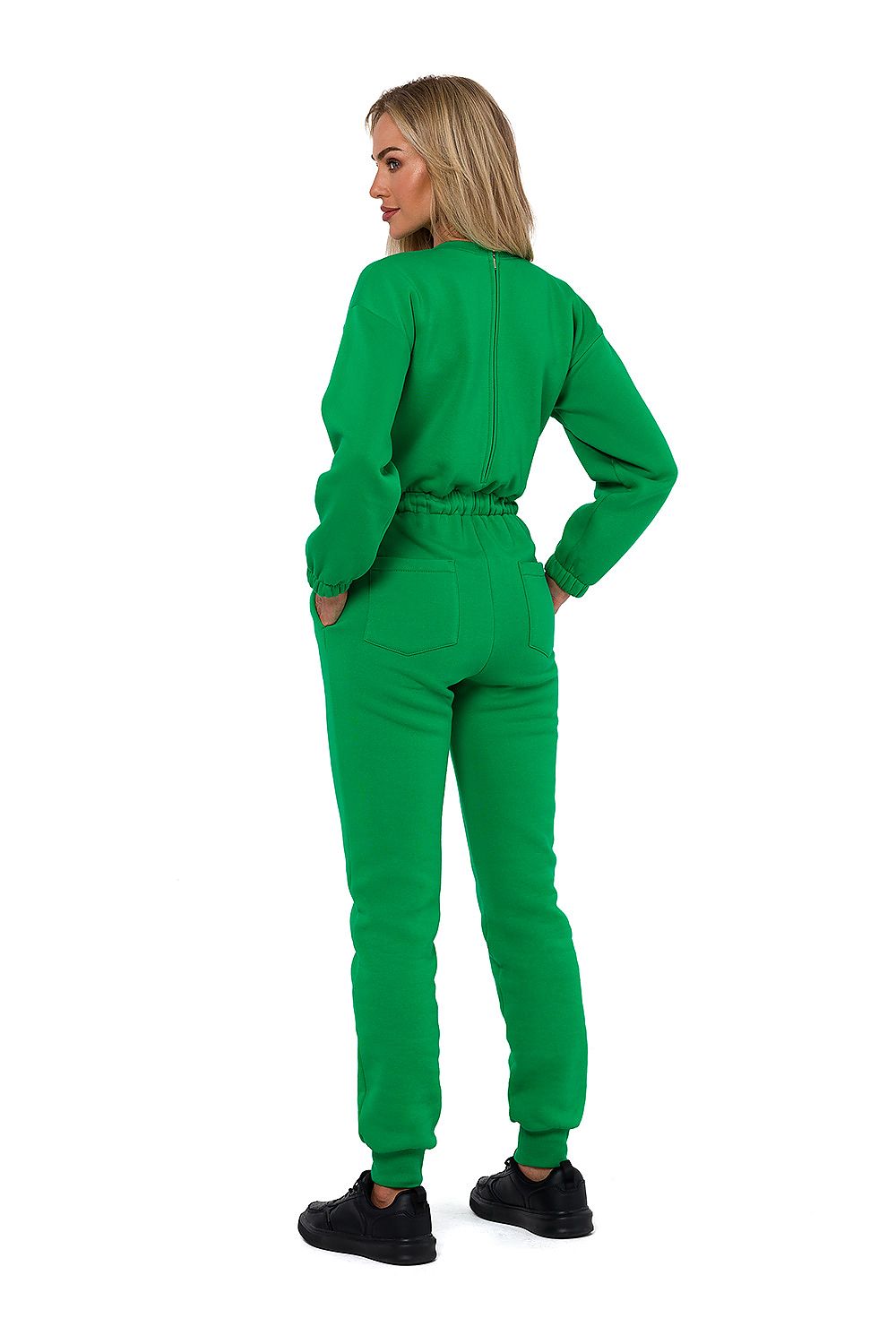 Detailed view of Moe Women's Luxury Suit featuring tailored long sleeves, flattering waist ties, and stylish side pockets, designed in Poland.