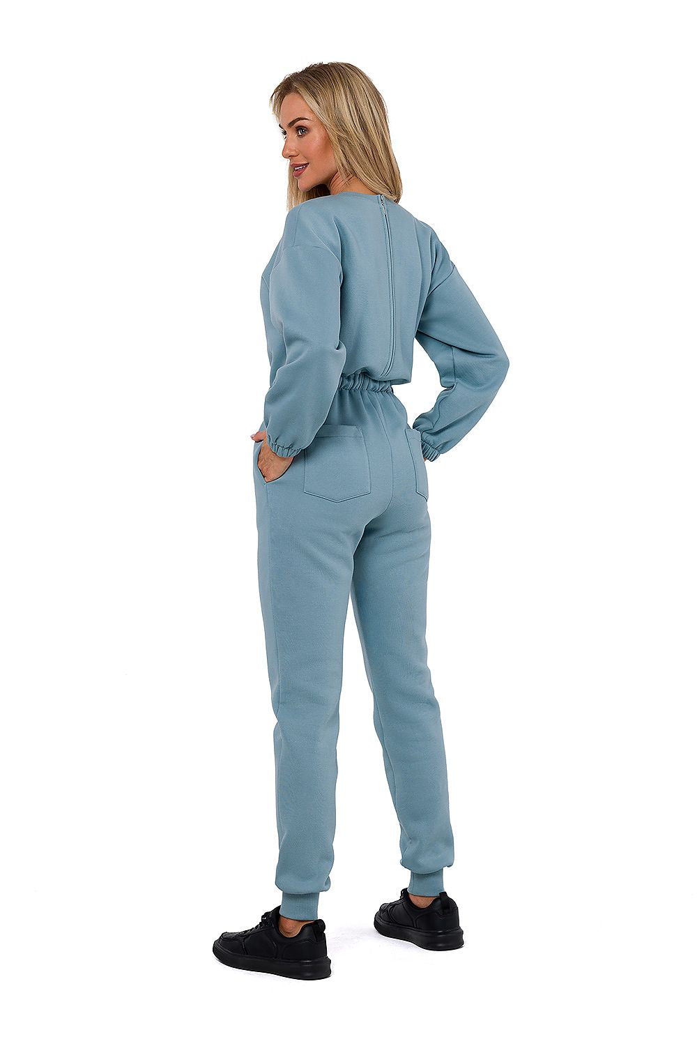 Luxury Women's Moe Suit in a sophisticated shade, detailing the elegant long sleeves and convenient side pockets, designed in Poland.
