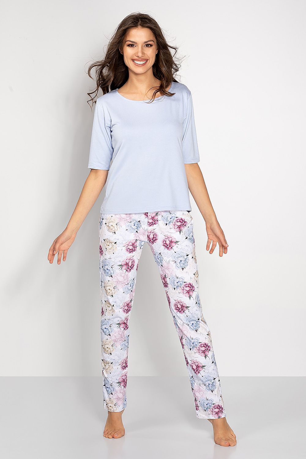 Luxury Women's Pyjamas Set by Momenti Per Me, featuring an elegant short sleeve blouse and comfortable long pants crafted in Poland, perfect for stylish relaxation.