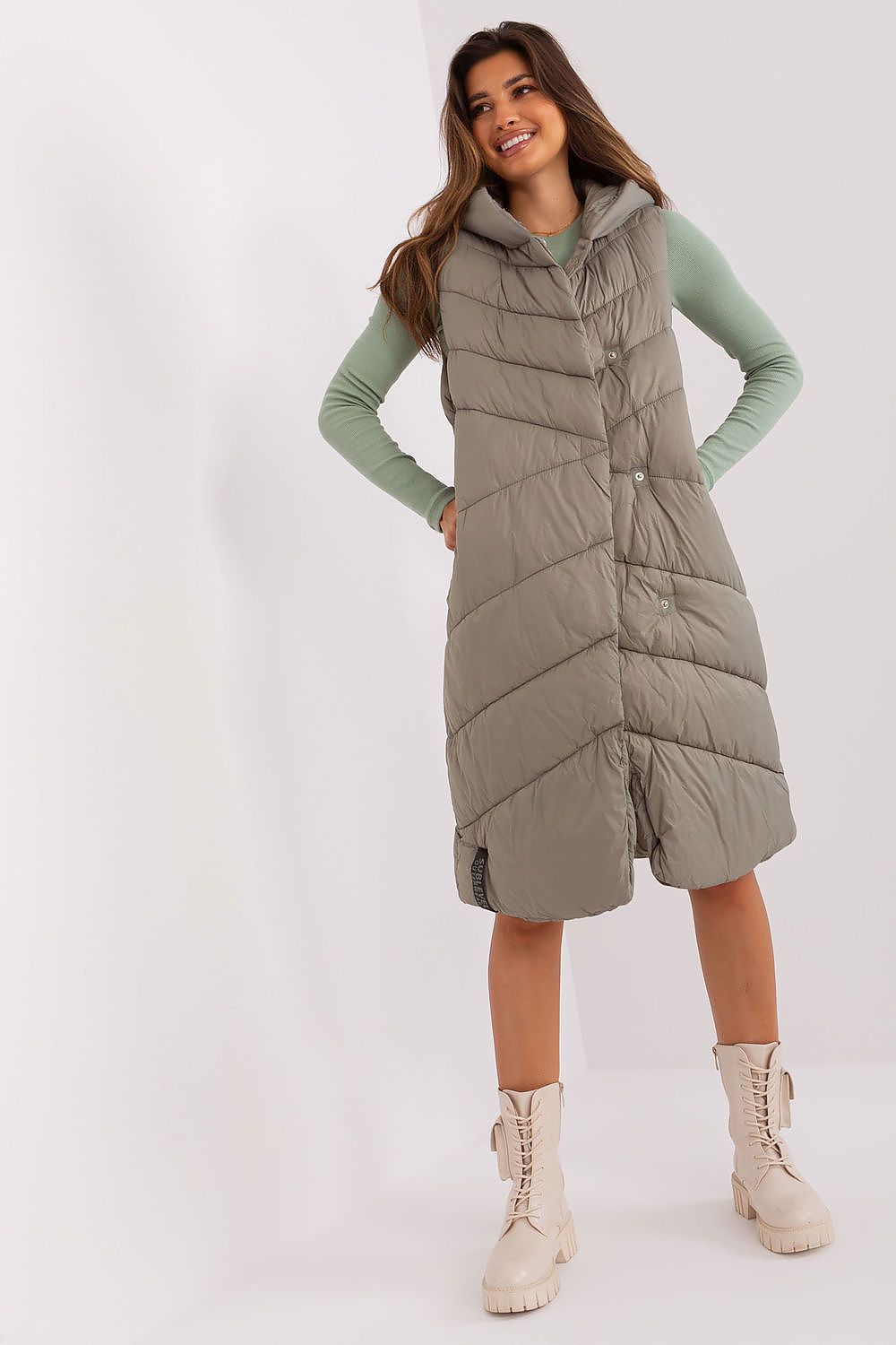 Sublevel Quilted Hooded Vest in luxurious polyamide features an insulated design, stylishly lined, equipped with practical side pockets, ideal for elegant layering in cooler weather.