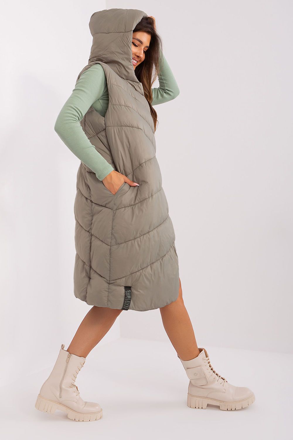 Stylish Sublevel Quilted Hooded Vest with a modern design, featuring a cozy hood and sophisticated quilting for ultimate warmth and comfort.