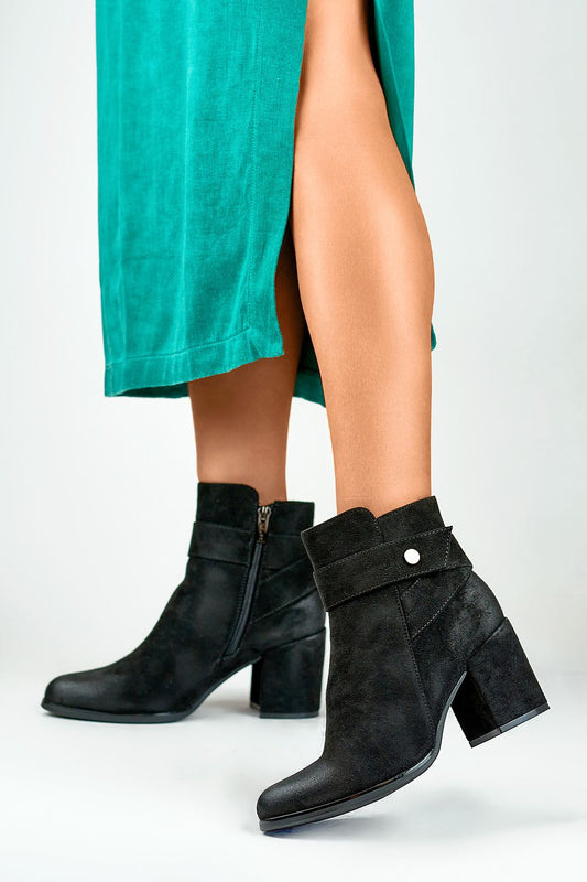 Stylish almond toe eco-suede heel boots by Primo, showcasing warm fur lining and a chic decorative strap.