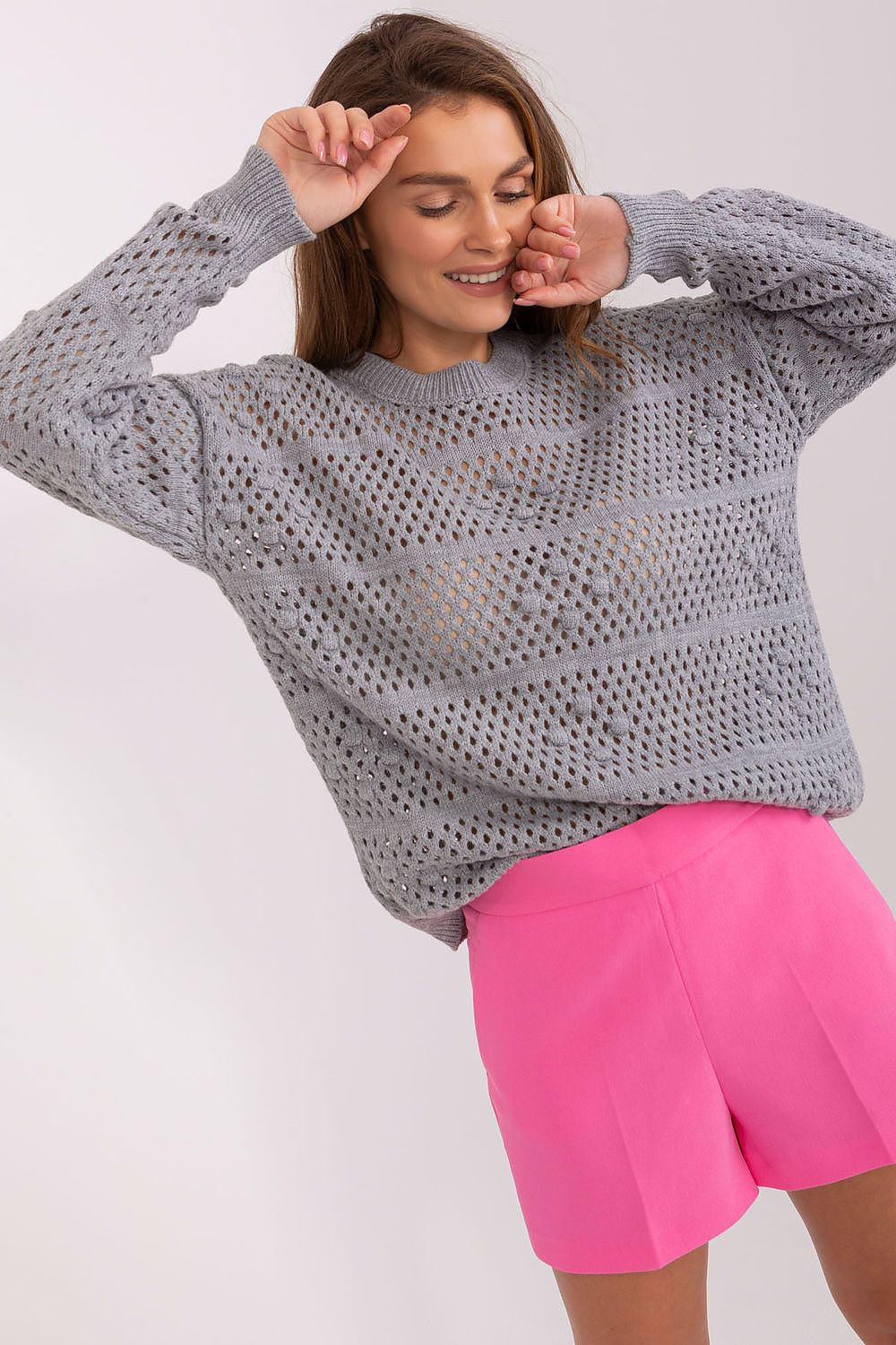 Badu elegant openwork sweater featuring a stylish open design, crafted from 70% acrylic and 30% wool for a luxurious casual look.
