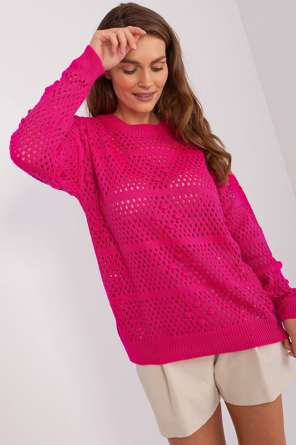 Badu Openwork Sweater featuring a luxurious openwork design, crafted from 70% acrylic and 30% wool, showcased in a casual setting, ideal for elegant everyday wear.