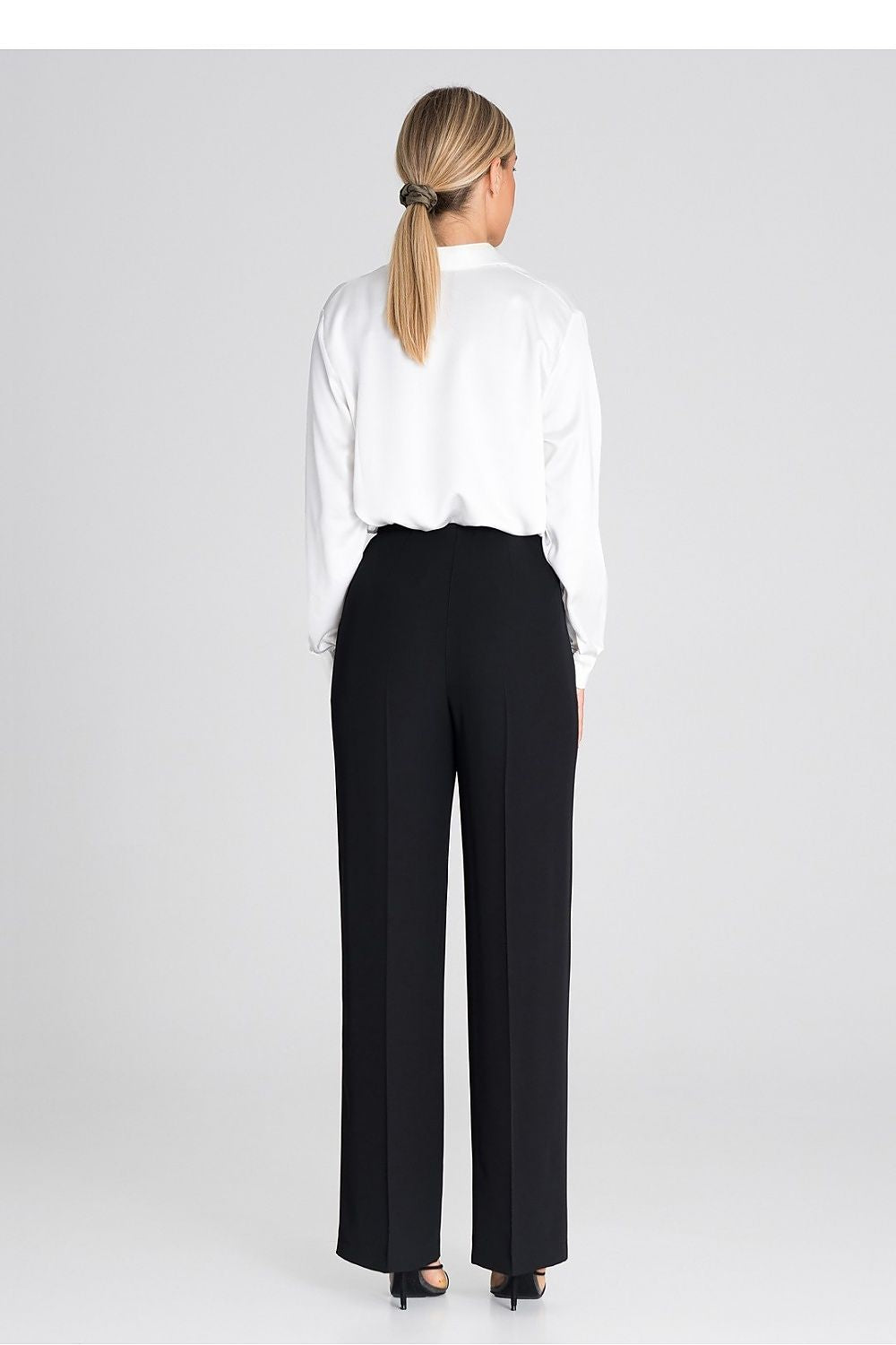 Chic Figl wide-leg trousers displayed with perfect fit, highlighting their extensive length and an effortlessly fashionable silhouette.
