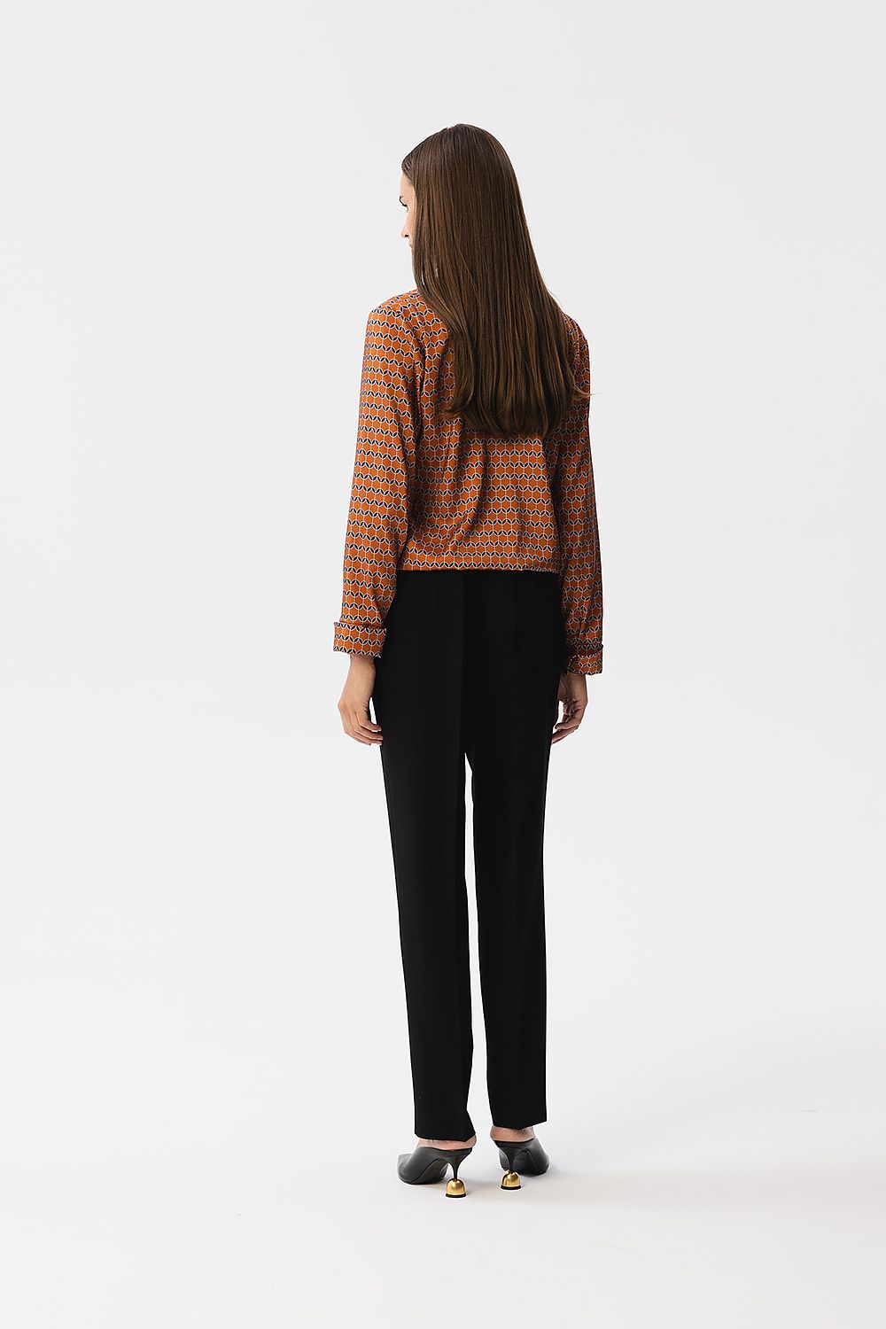 Close-up of Stylove satin blouse showcasing the exquisite printed fabric and refined button cuff detail on the long sleeves.