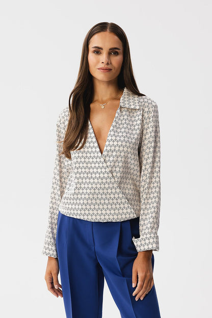 Stylove blouse displayed on a model, emphasising its luxurious fit and stylish neckline with a mini fastener for an elegant silhouette.