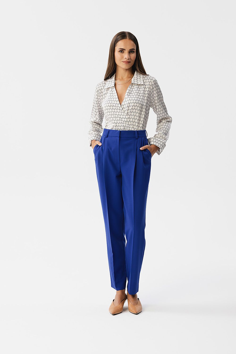 Stylove satin blouse with elastic band at the bottom, highlighting the cinched waist design and modern envelope cut.