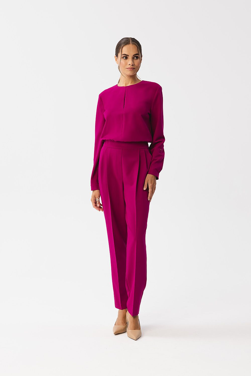 Stylove jumpsuit showcasing long sleeves with cuffs and elegant fold-over details for a luxurious fit.