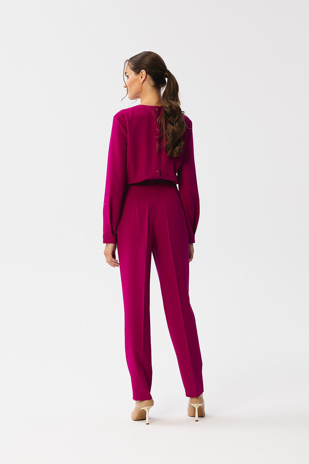 Side view of the Stylish One-Piece Jumpsuit by Stylove, highlighting its practical side pockets and elegant silhouette.