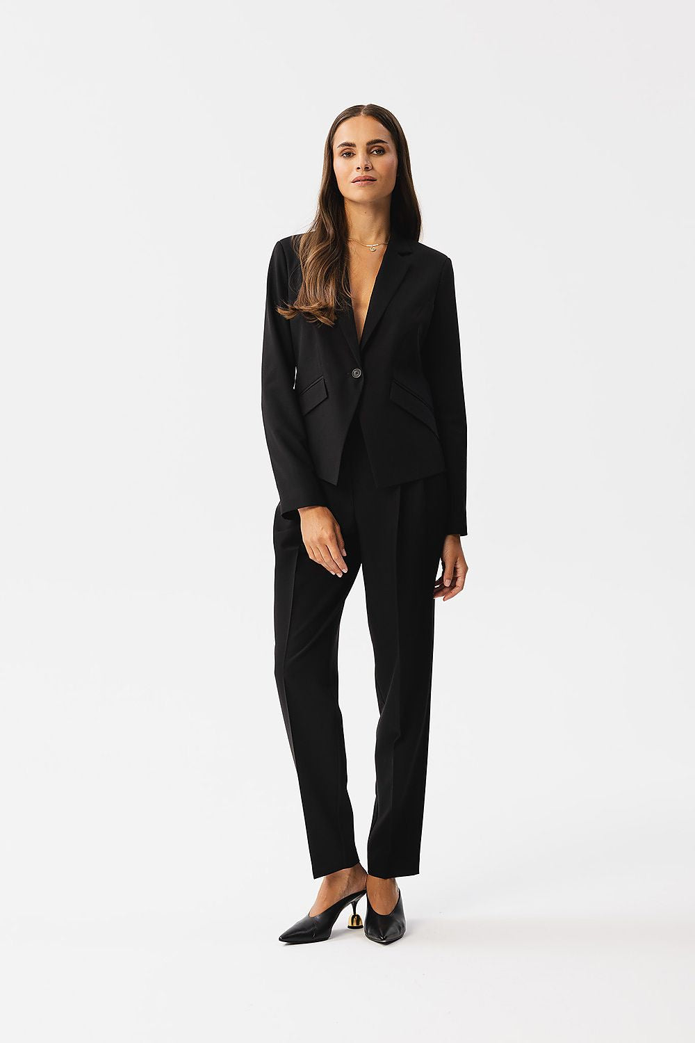 Detailed shot of the luxurious fabric used in Stylove's elegant jacket, highlighting its premium quality and texture.