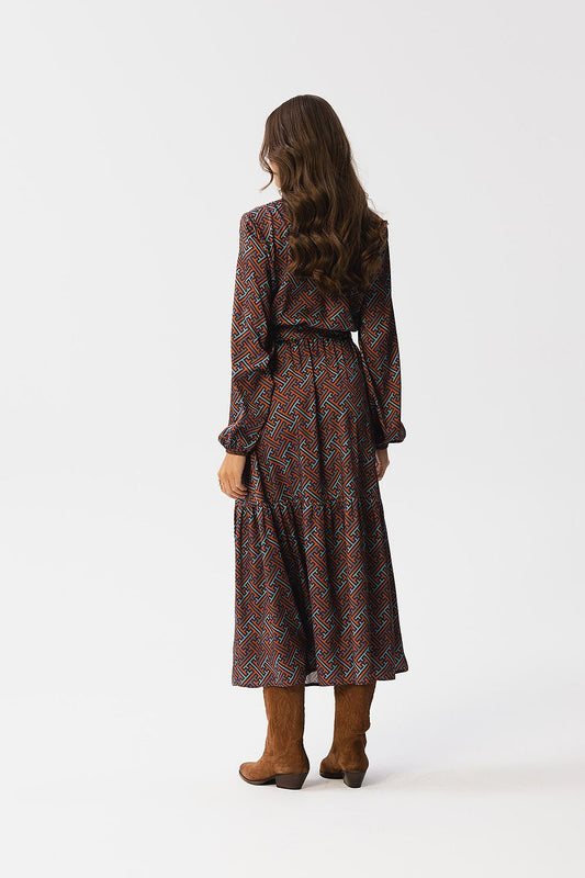 Stylove Maxi Dress with waist tie detail and stylish long sleeves, showcasing a sophisticated design for elegant occasions.