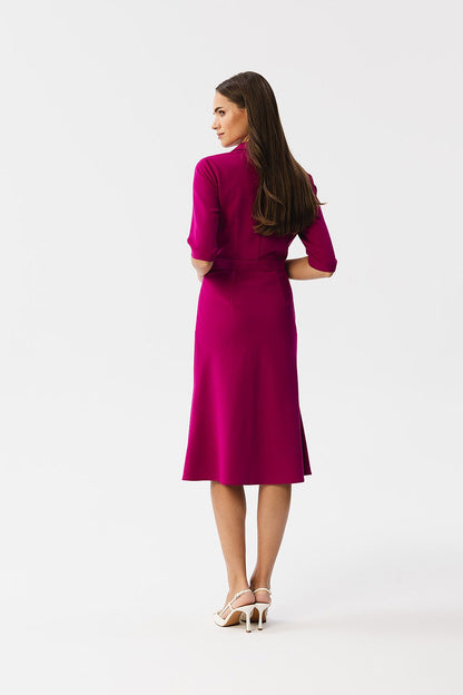 Stylove knee-length daydress draped gracefully on model, highlighting elegant silhouette and versatile elbow-length sleeves.