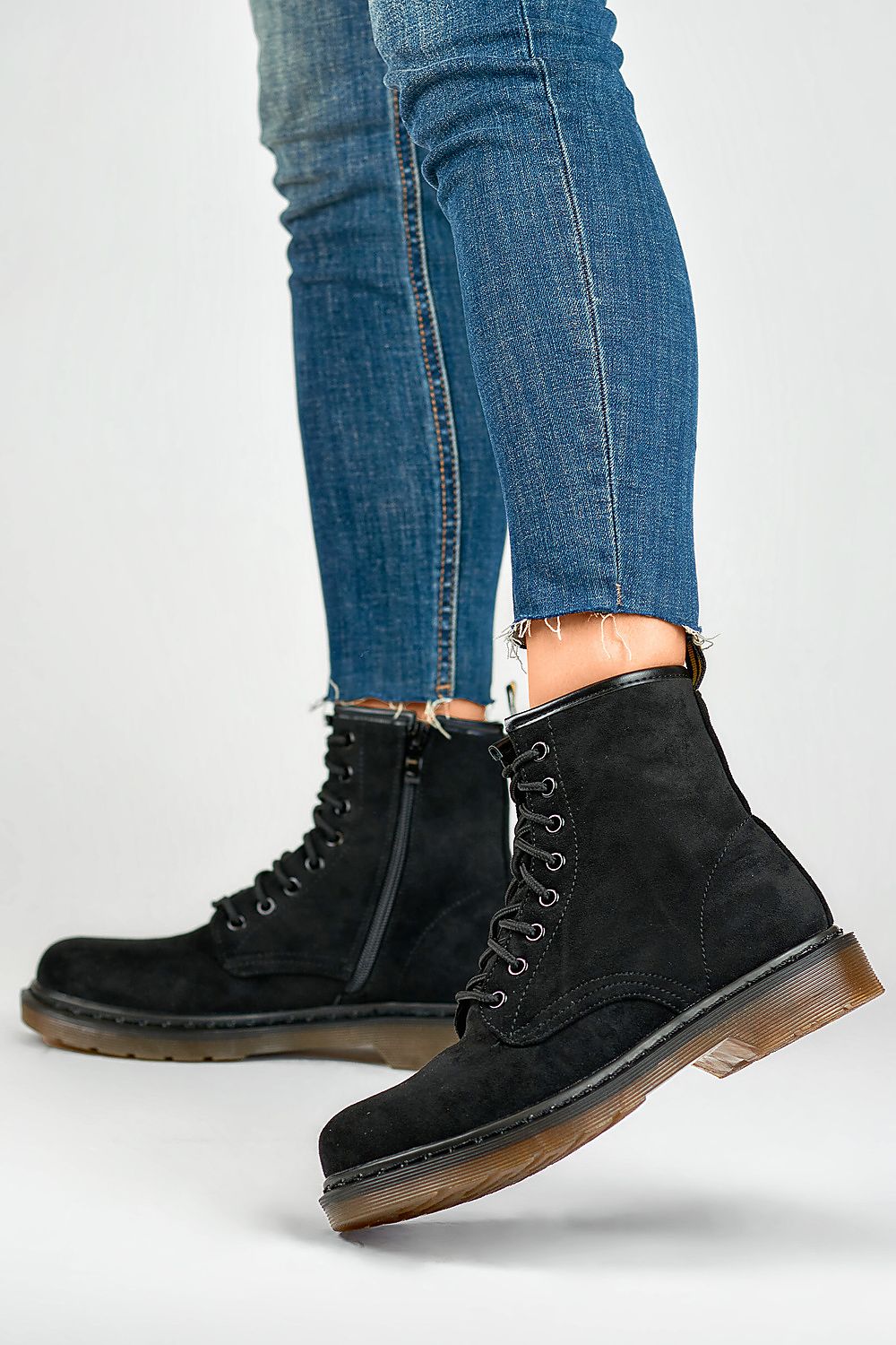 Close-up view of PRIMO eco-friendly suede black booties with luxurious textile insole, showcasing the sleek zipper and lacing design for comfort and elegance.