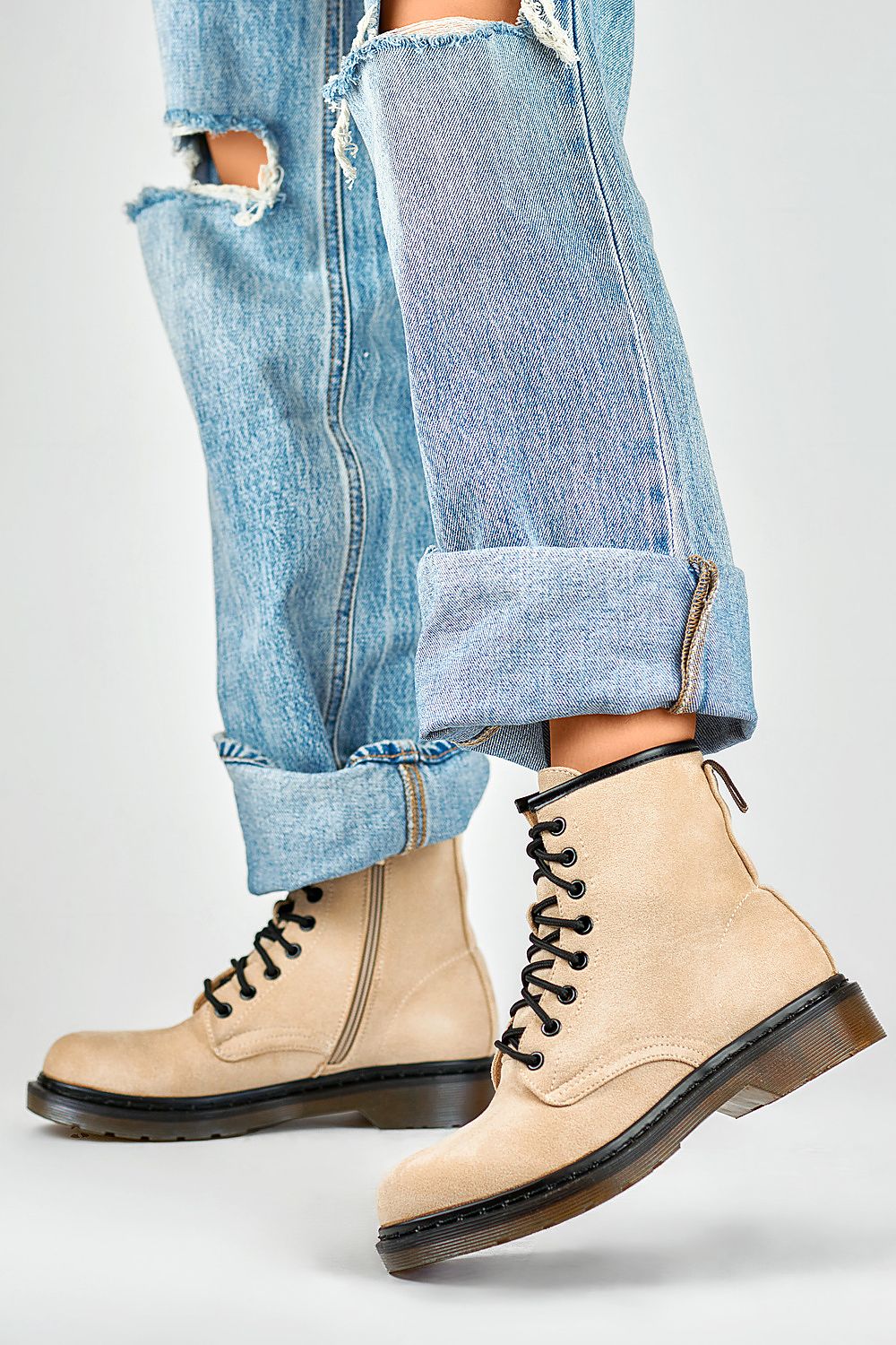 Fashionable PRIMO black booties designed for versatility, featuring lace-up and zipper closure for easy wear and a luxe aesthetic.