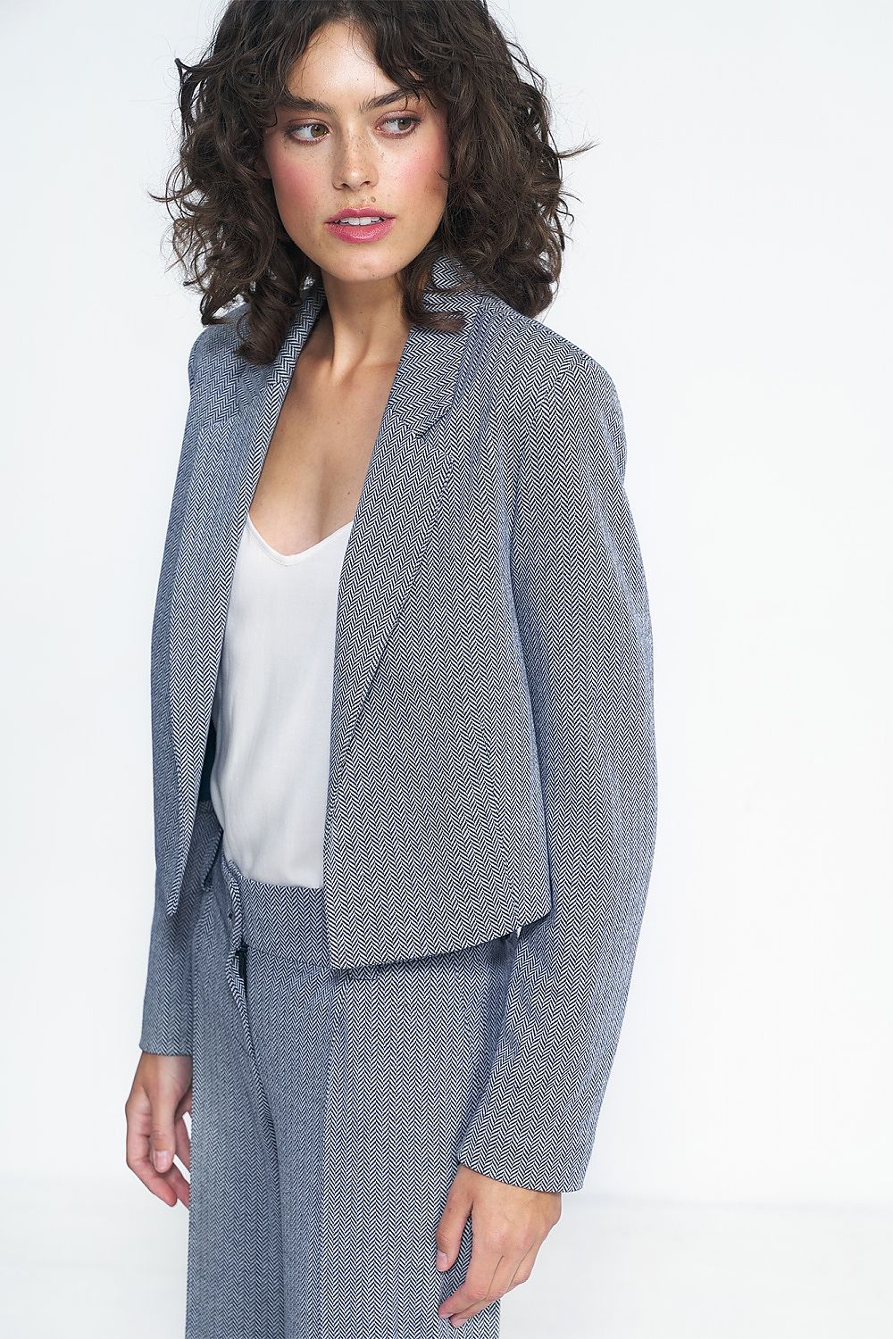 Chic Nife Women's Short Jacket in universal hue, perfect for creating trendy office and casual ensembles.