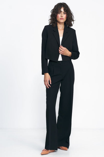 Elegant short black jacket by Nife, perfect for versatile styling in both office and casual settings.