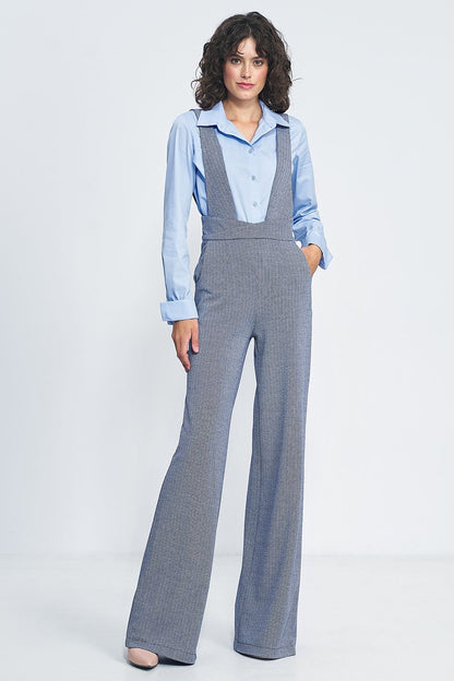 Fashionable high-waisted jumpsuit by Nife presented in a bright setting, emphasizing its practicality and vintage flair.