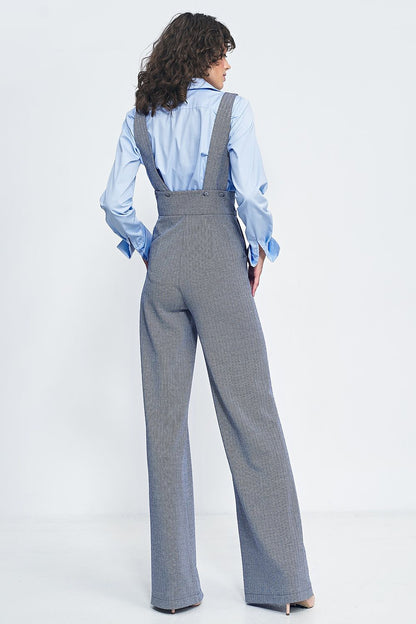 Elegant high-waisted jumpsuit by Nife featuring suspenders, wide legs, and practical pockets, showcasing a vintage-inspired style perfect for sophisticated fashion lovers.